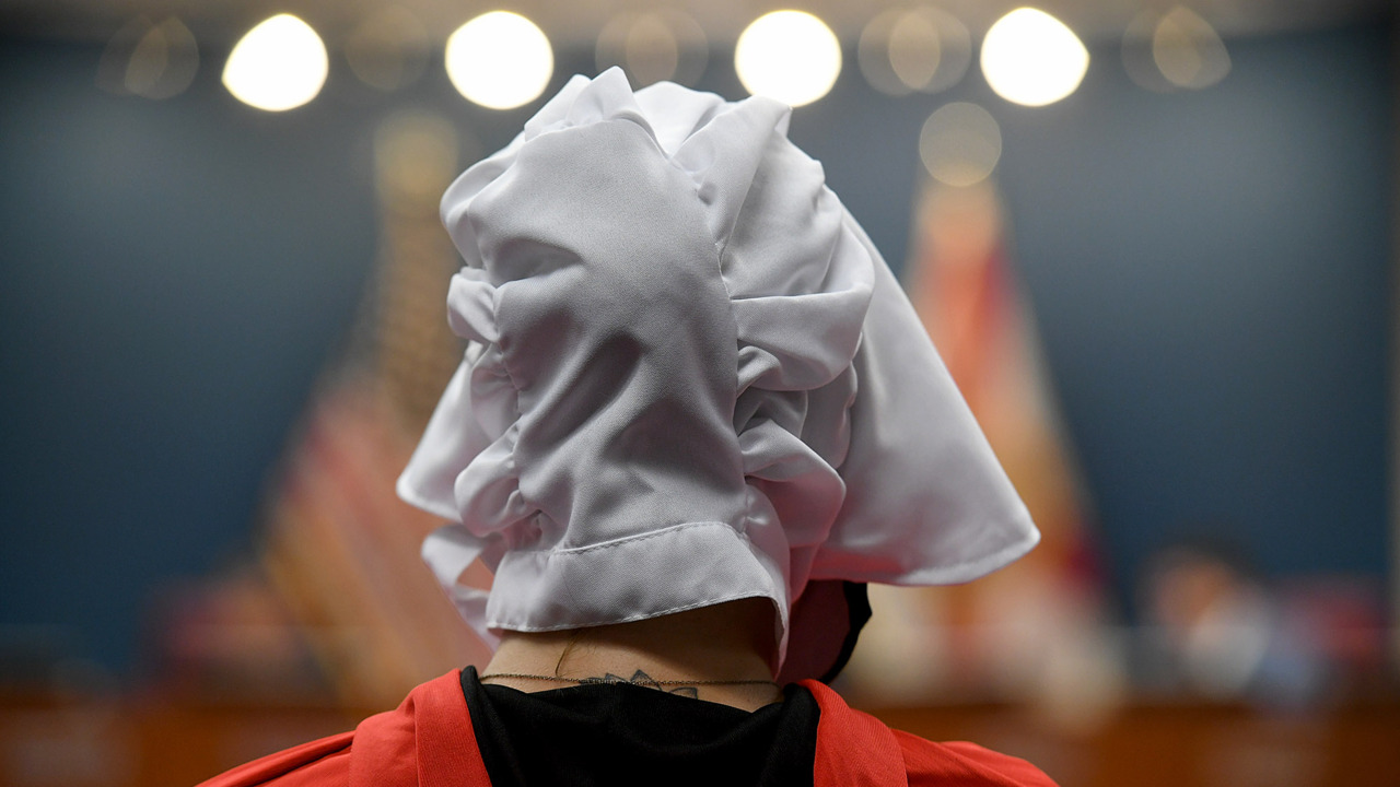 Altered Photo Shows Dallas Cowboys Cheerleaders Dressed as Handmaids