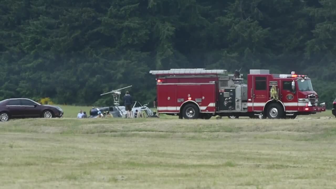 Emergency crews respond to a helicopter crash near NW Helicopters at the Olympia Airport