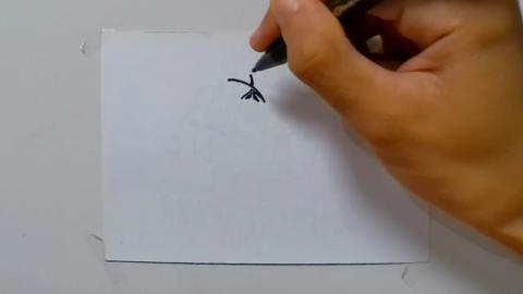 Drawing big zombie graffiti with middle finger