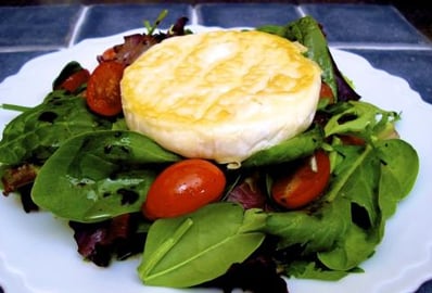 Mixed Green Salad Topped with a Pan-Seared Camembert Chee...