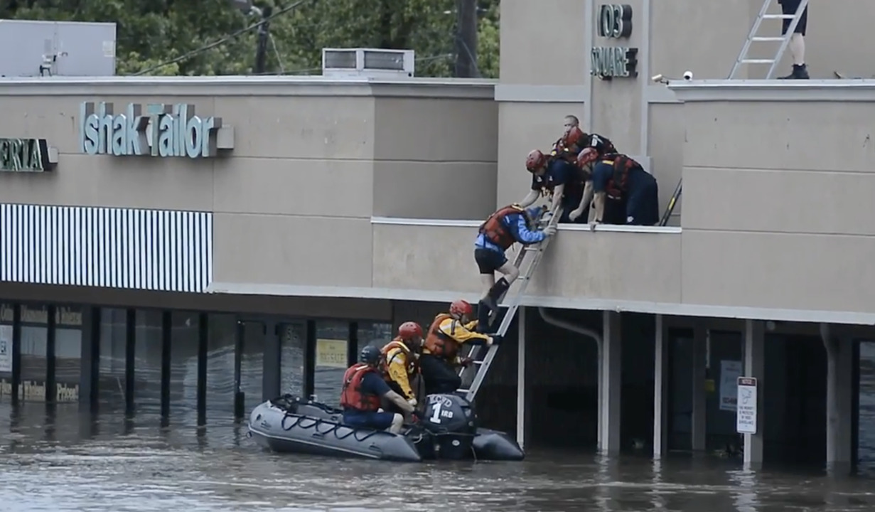 Dramatic video Two rescued from flooding in Coach's Bar & Grill in