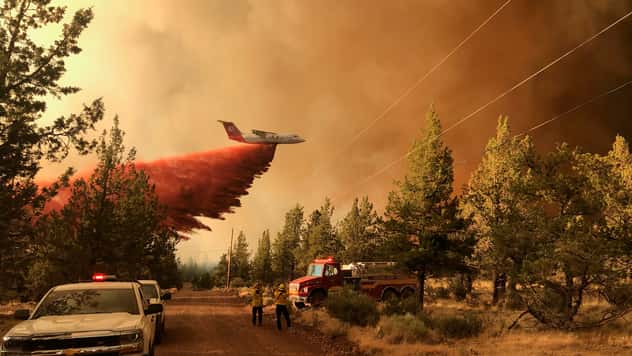 Wildfires rage across parched western US as smoke chokes the sky