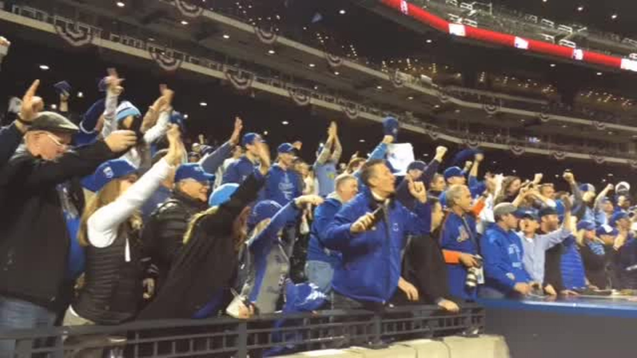 Kansas City Royals closer Wade Davis catcher Drew Butera, Salvador Perez  (L) and Alex Gordon (R) celebrate as the Royals win the World Series  defeating the New York Mets 7-2 in game