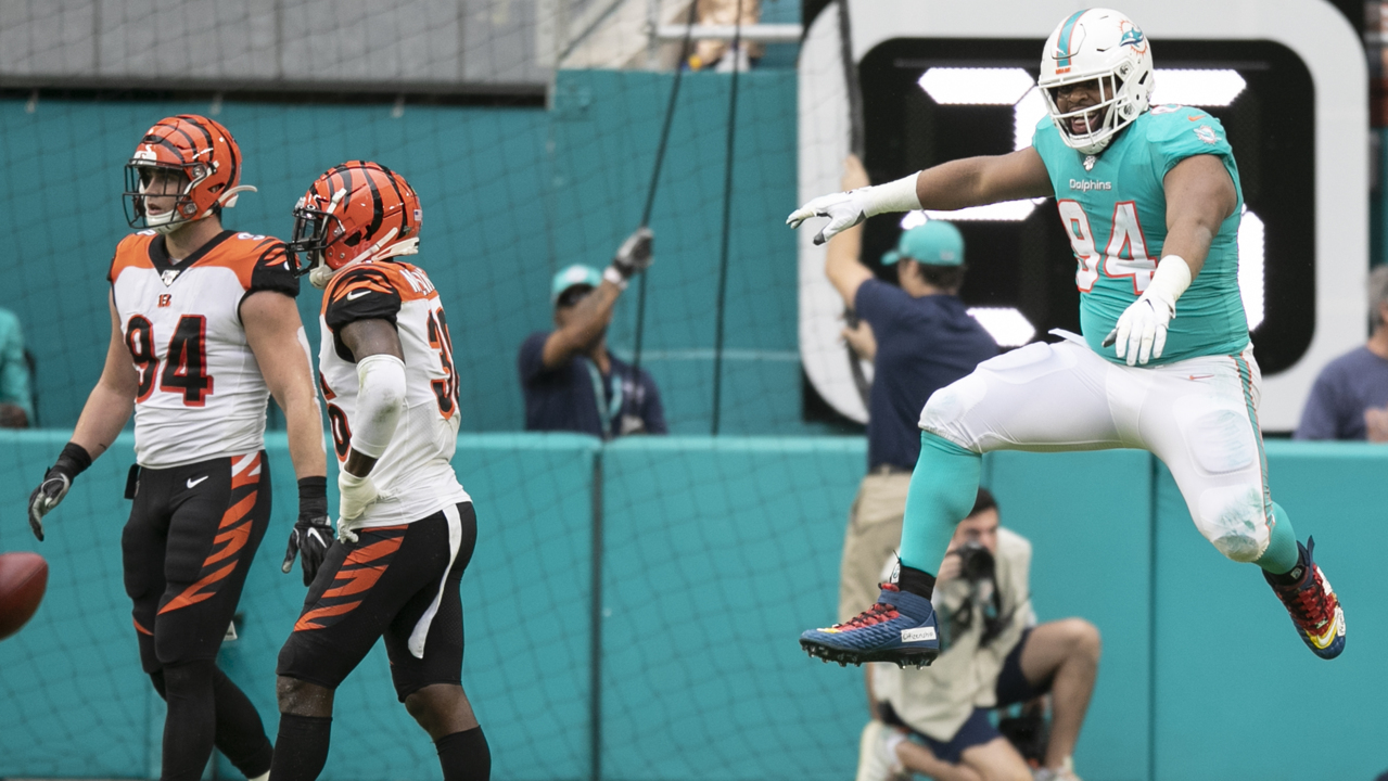 Miami Dolphins defensive tackle Christian Wilkins (94) cheers after scoring  a touchdown, during the first half at an NFL football game against the  Cincinnati Bengals, Sunday, Dec. 22, 2019, in Miami Gardens