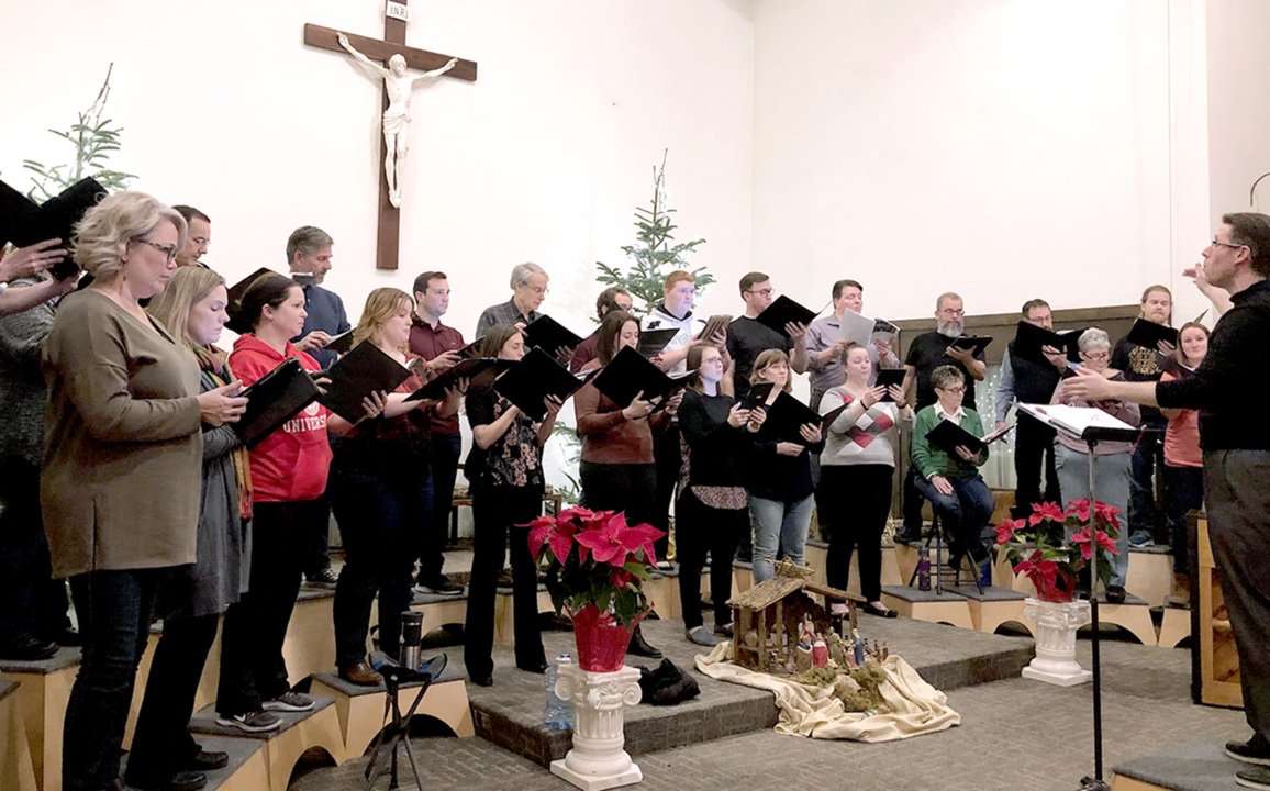 Justin Raffa, the director of the Mid-Columbia Mastersingers, conducts ...