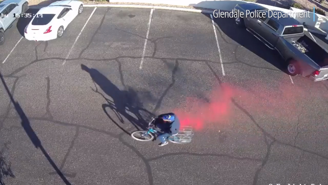 Arizona bank robber flees on bike in pink puff of smoke from dye pack ...