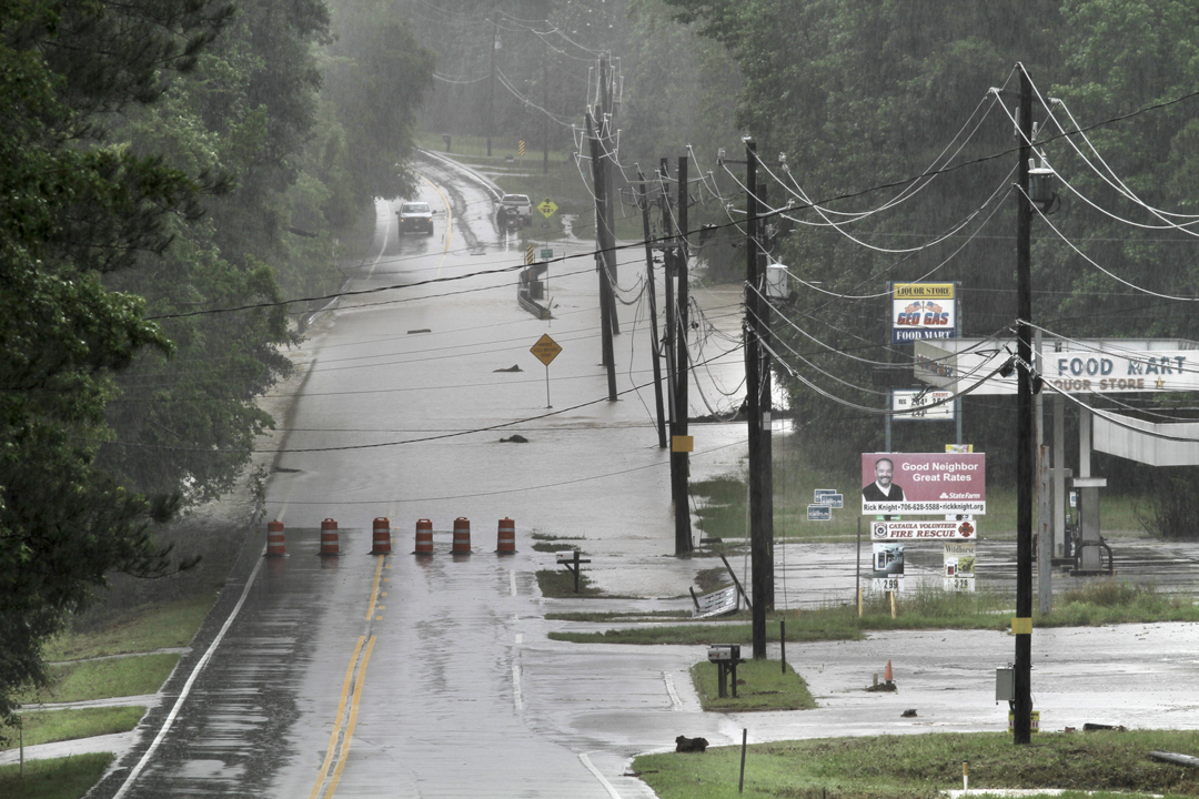 Heavy rains flood Standing Boy Creek and close the bridge on U.S