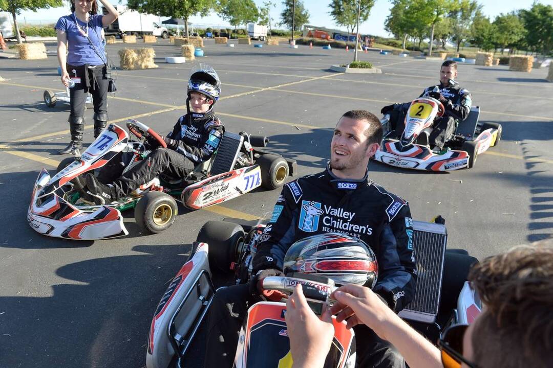 Derek, David Carr race teen in gokarts during Valley Children's visit