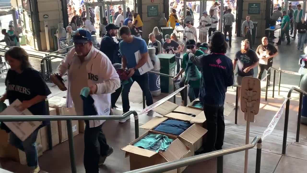 Fans chant "Let's Go Mariners!" dancing, singing as TMobile Park gates