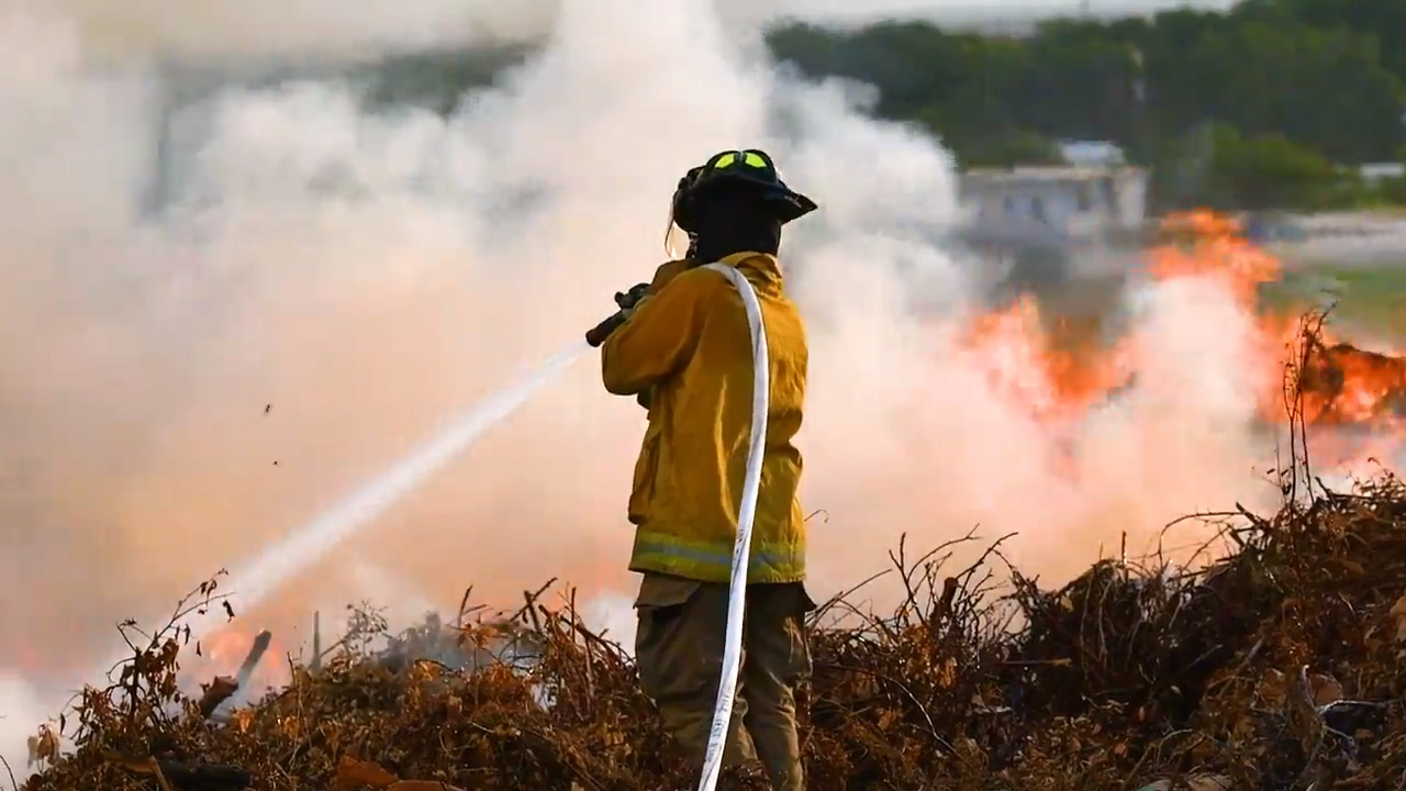 pile of mulch catches fire and burns for several hours before being extinguished by fire