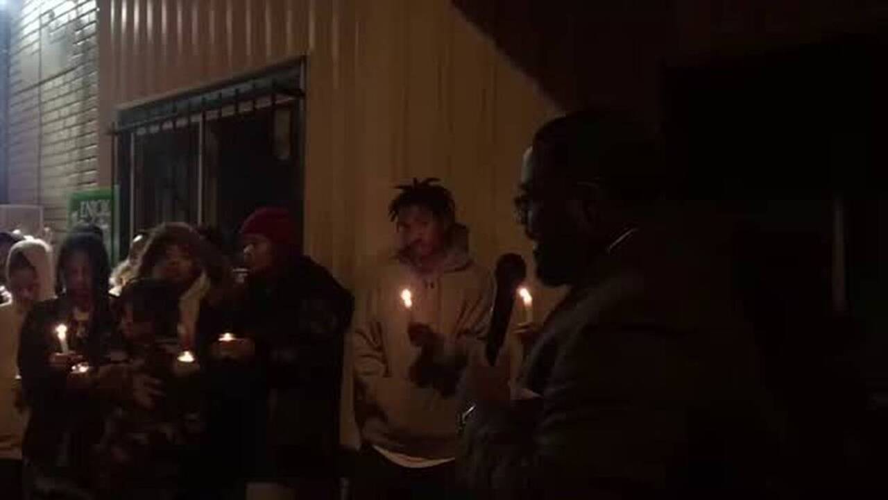 Pastor Branden Mims speaks to mourners at vigil for Daryl Singleton