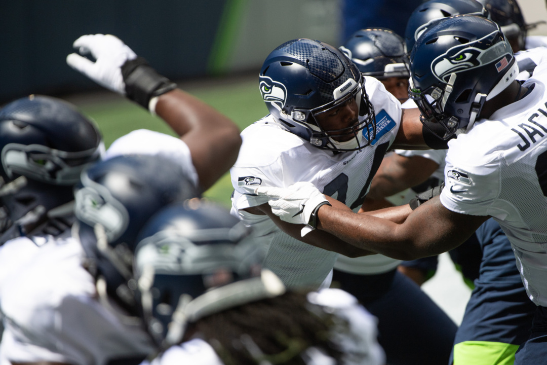 Seattle Seahawks head coach Pete Carroll, center, huddle with defensive  coordinator Ken Norton and defensive captain, Seattle Seahawks middle  linebacker Bobby Wagner (54) during the fourth quarter against the Arizona  Cardinals at