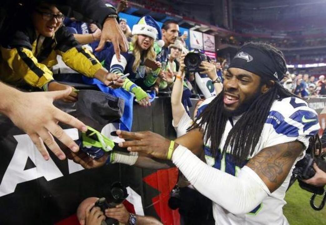 Seattle Seahawks cornerback Richard Sherman (25) against the New Orleans  Saints during an NFC divisional playoff NFL football game in Seattle,  Saturday, Jan. 11, 2014. (AP Photo/Ted S. Warren Stock Photo - Alamy