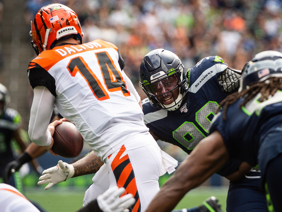 Seahawks' Quinton Jefferson tries to climb into stands to confront fans