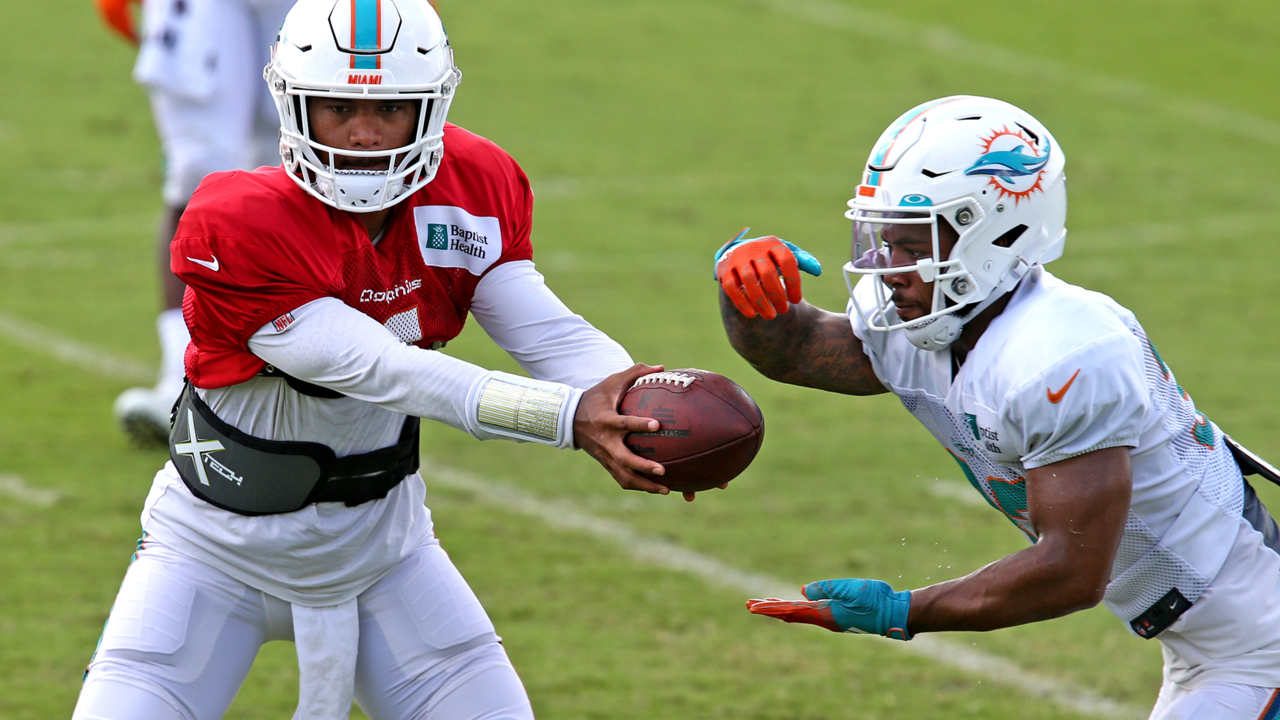 Miami Dolphins running back Salvon Ahmed (26) breaks the tackle of Raiders  defensive tackle Mau …