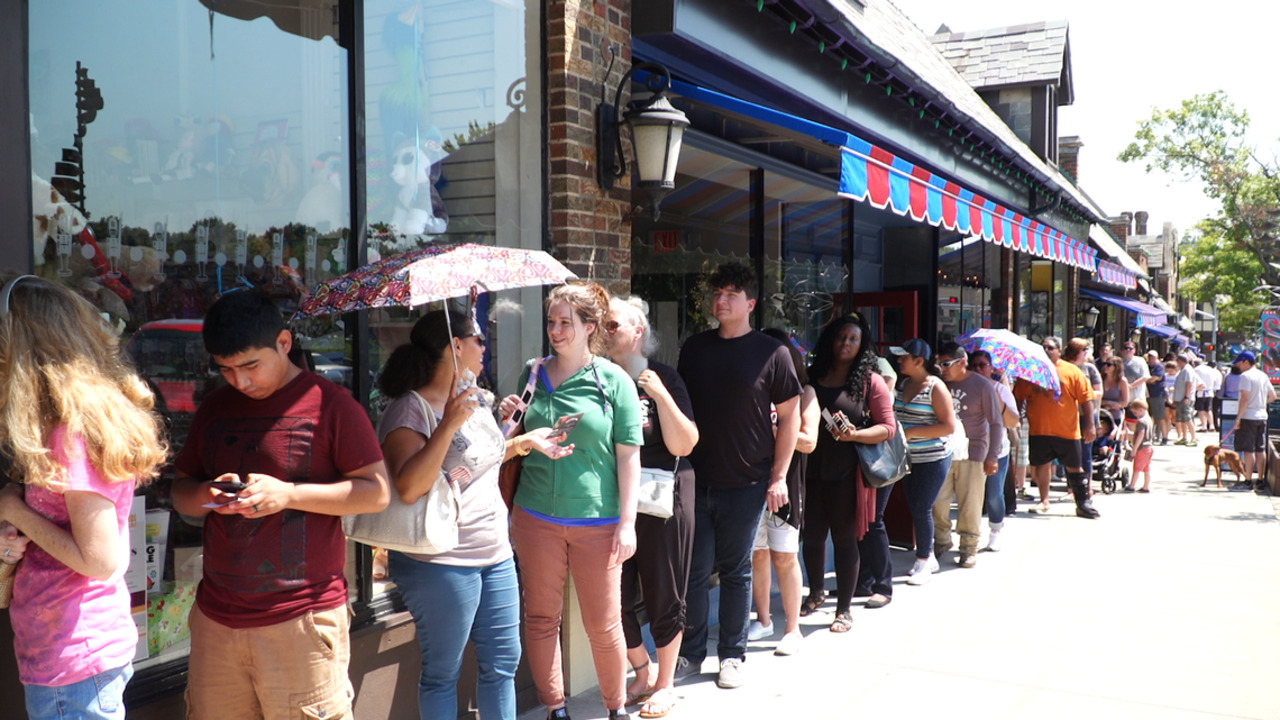 Buyers of eclipse glasses form blockslong line outside toy store