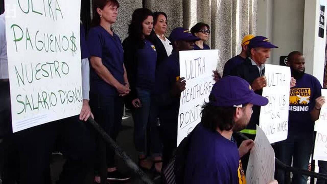 Airport workers protest against contractor for wage violations | Miami ...