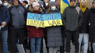 People attend a pro-Ukraine protest rally in front of the Hofburg palace in Vienna, Austria, Friday, Feb. 25, 2022 the day after Russian troops have launched their anticipated attack on Ukraine. (A...