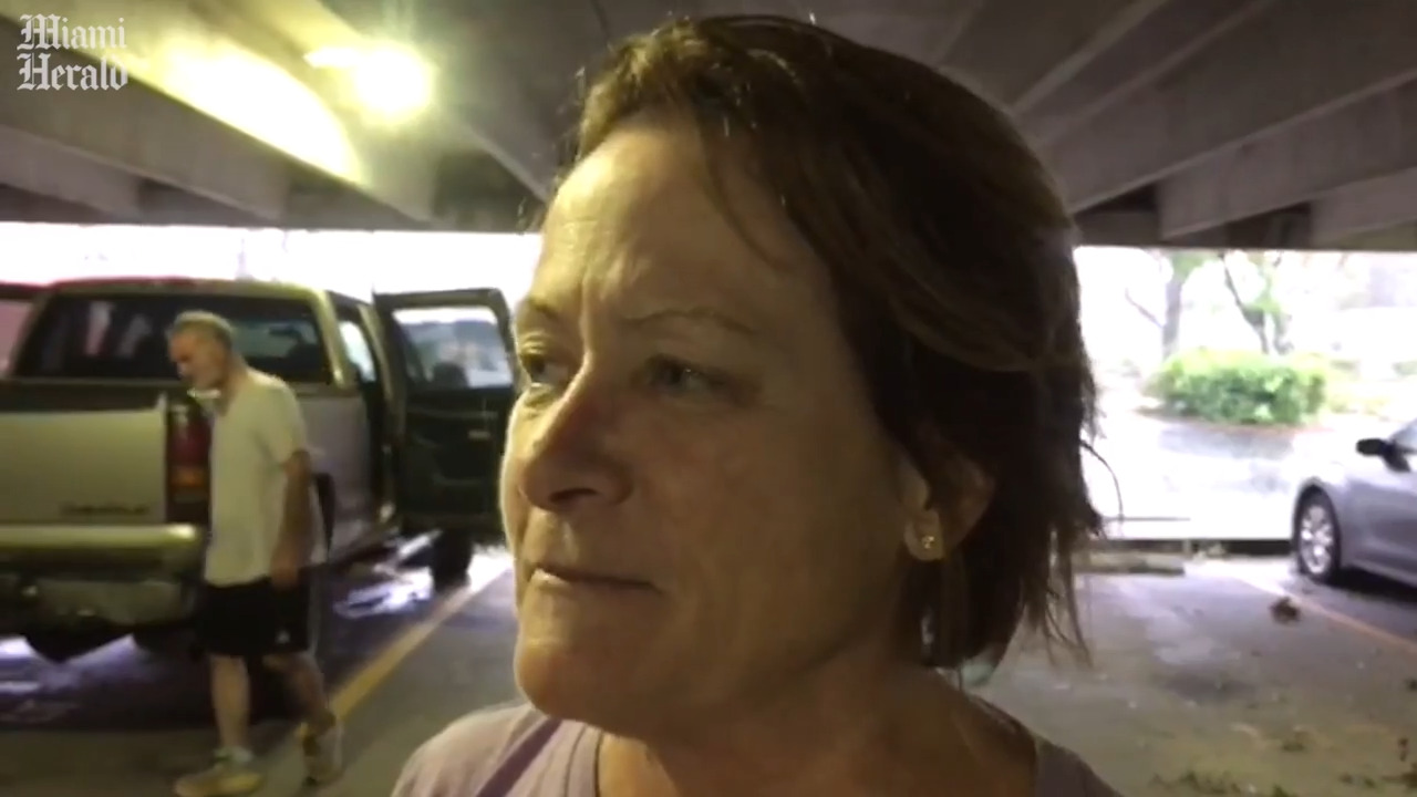 Veterinarian and pets wait at parking garage during Hurricane Ian