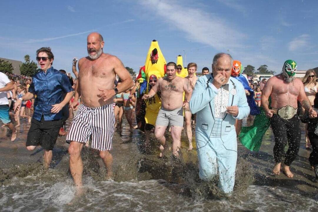 Watch thousands brave the cold water at Cayucos Polar Bear Dip The State