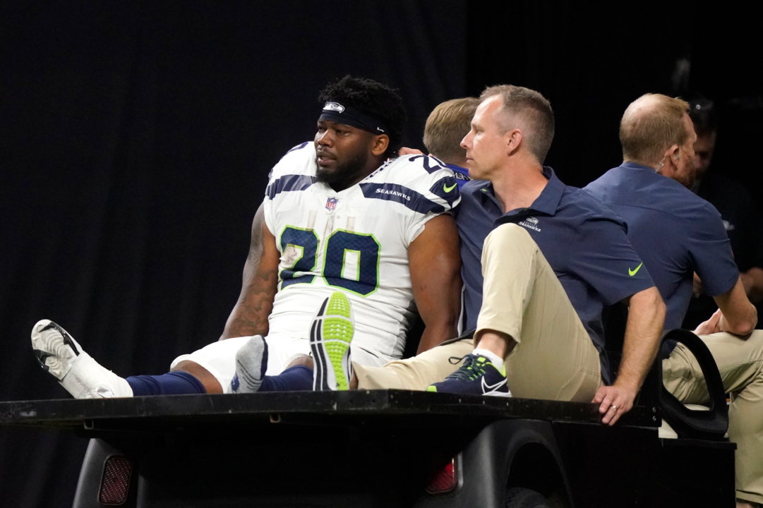 The referee performs the coin toss before an NFL football game between the  New Orleans Saints and the Seattle Seahawks in New Orleans, Sunday, Oct. 9,  2022. The Saints won 39-32. (AP