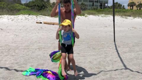 Rainbow Silk at Cocoa Beach - Teddy helping the kids