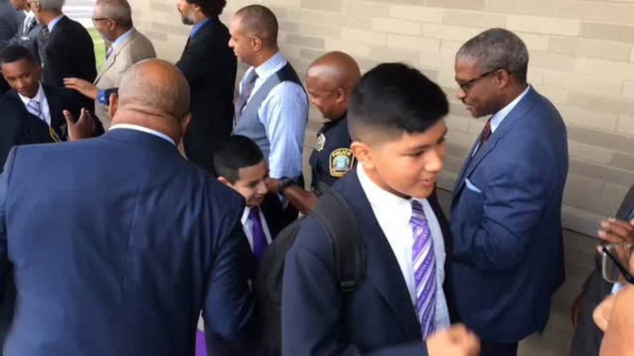 Woodson Academy students greeted with highfives, fistbumps Kansas
