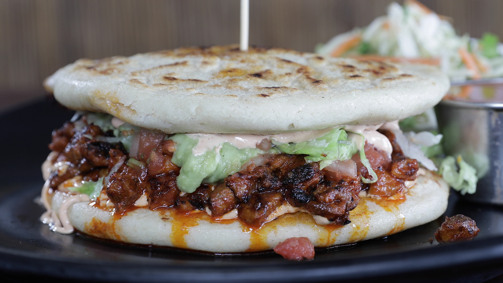 Don Julio's restaurant uses pupusas as buns for this unique burger dish