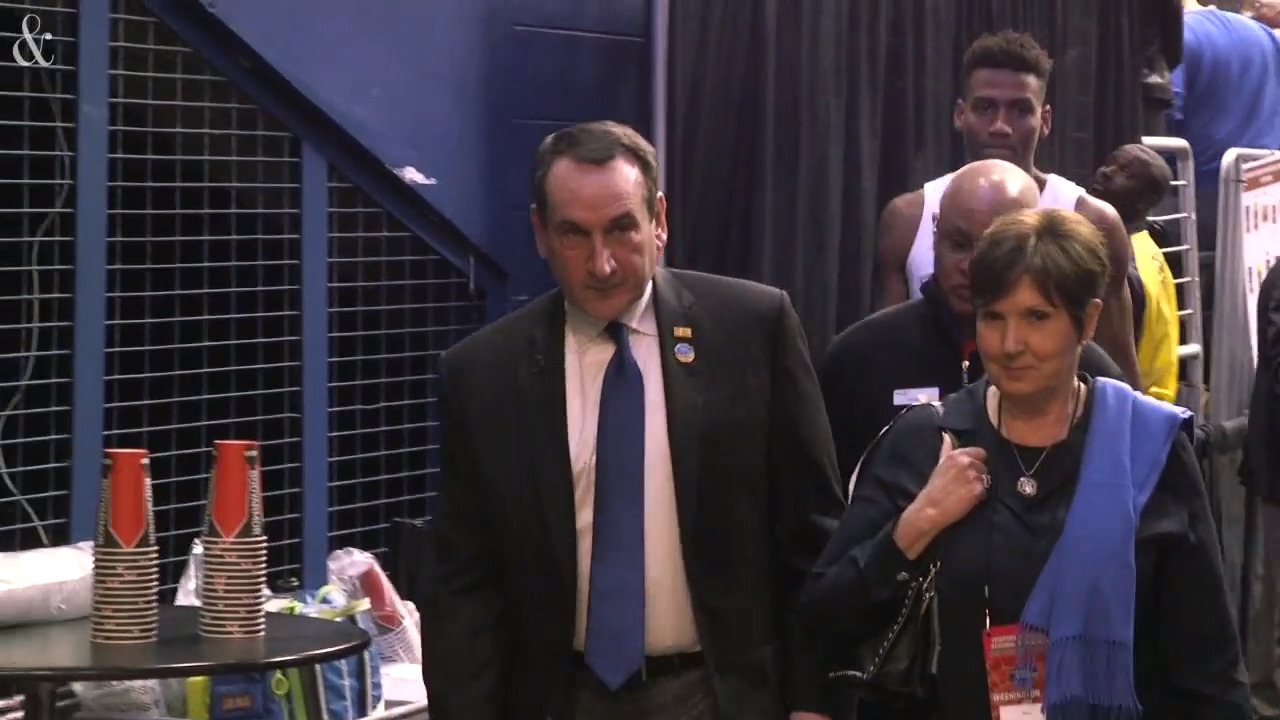 Coach K, wife Mickie, walk to locker room after Duke victory Raleigh