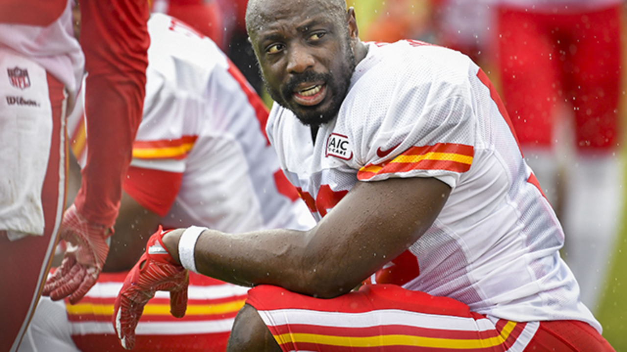 Kansas City Chiefs linebackers Justin Houston (50) and Tamba Hali (91) walk  between drills at NFL football t…