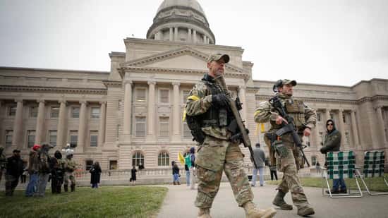 Armed protesters gather outside KY Capitol, rail against McConnell, Paul and Beshear