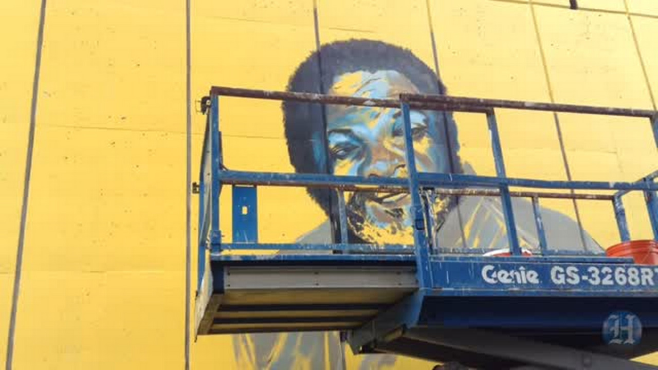 Video Artist paints to Overtown mural Miami Herald