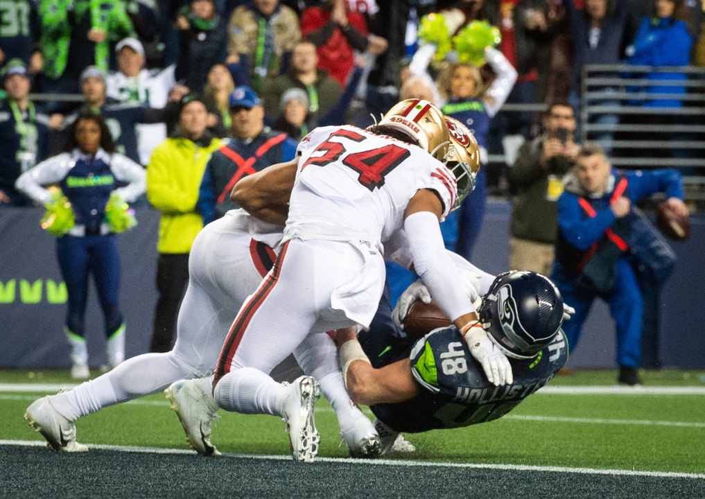 Seattle Seahawks running back Marshawn Lynch (24) dons his gloves during an  injury time out during the NFL Championship Game against the San Francisco  49ers at CenturyLink Field in Seattle, Washington on