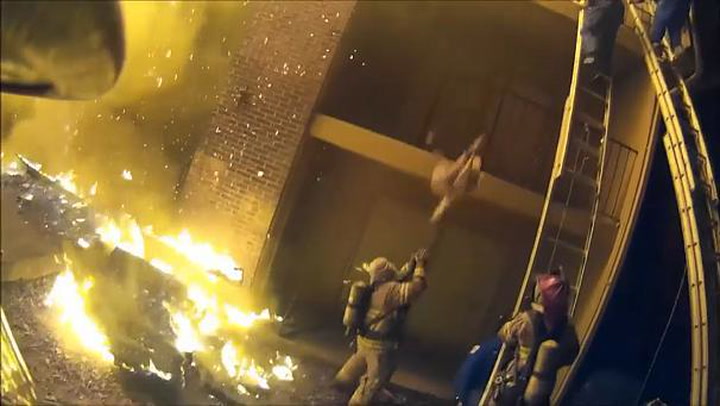 Stunning video shows firefighter catching child dropped from second ...
