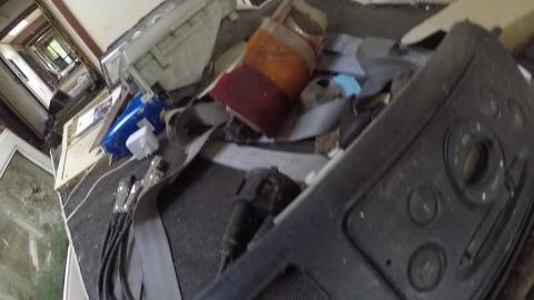 WEIRD ABANDONED BUILDING WITH CAR PARTS AND OLD TVs