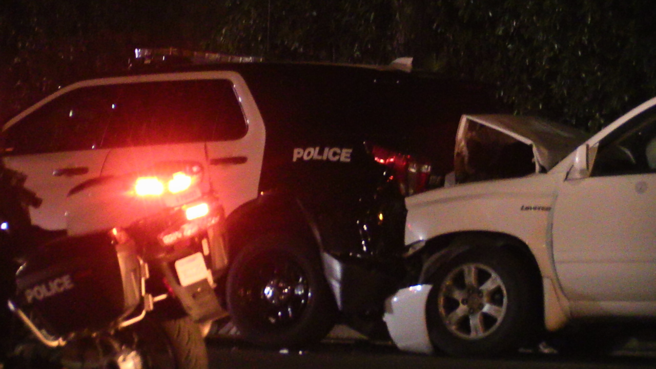 Four hurt in crash that pushed car partially into canal in Fresno