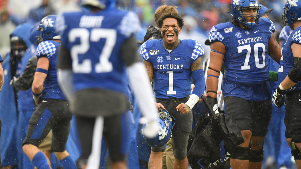 Kentucky's Lynn Bowden Jr. stands on the field after leading his