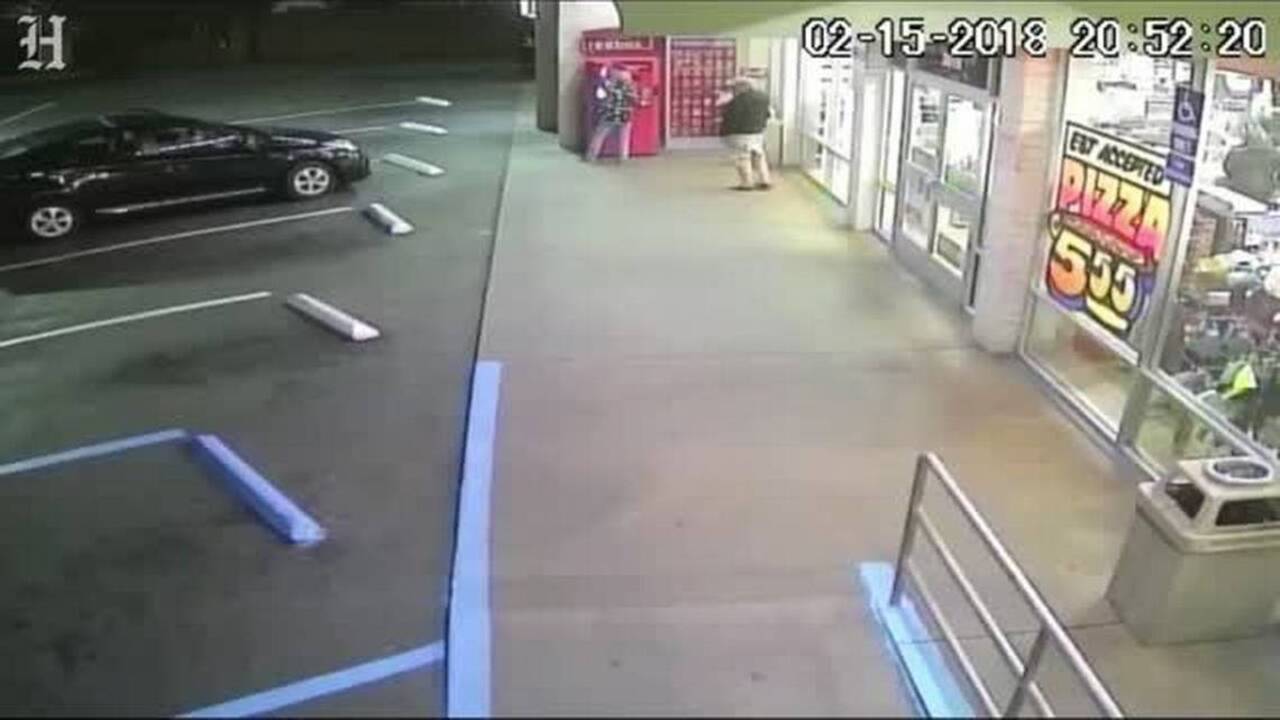 Man violently shoves woman using Redbox movie machine in surveillance ...