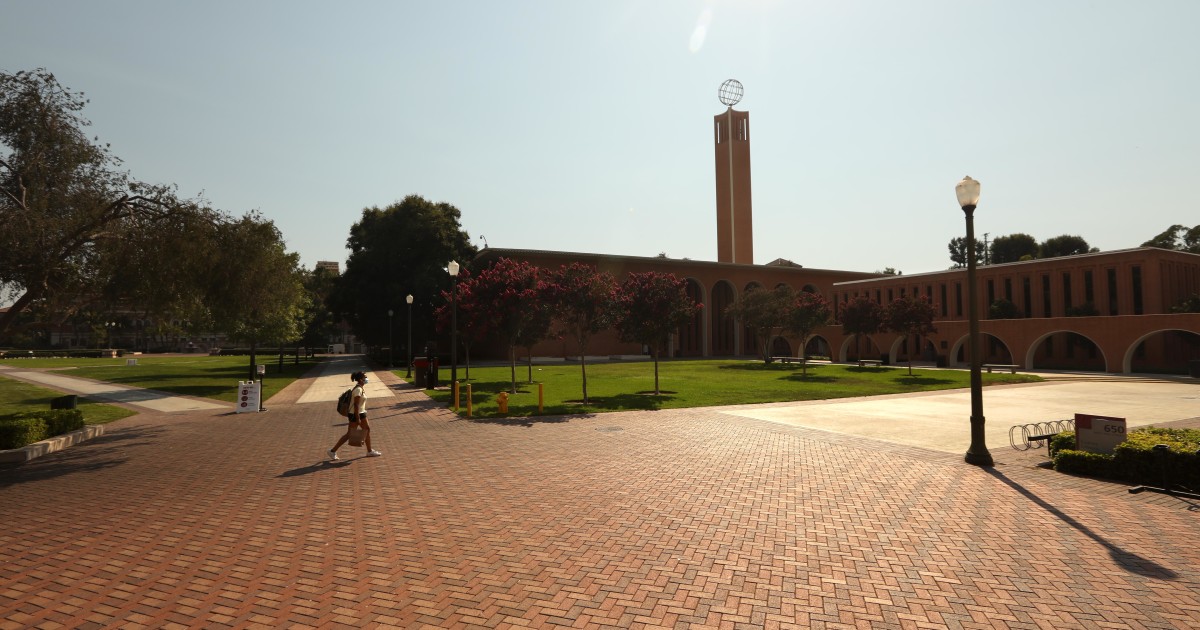LOS ANGELES, CA - AUGUST 17, 2020 - - A lone student walks across an empty section of the USC campus on the first day of academic instruction for the Fall 2020 semester in Los Angeles on August 17,...