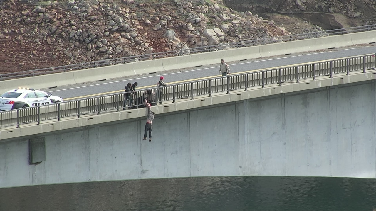 CA sheriff's deputy saves man jumping off bridge Modesto Bee