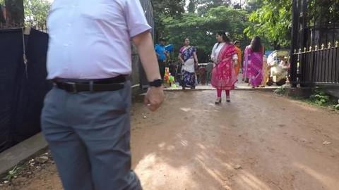 Walking Down A Busy Road At Bengaluru