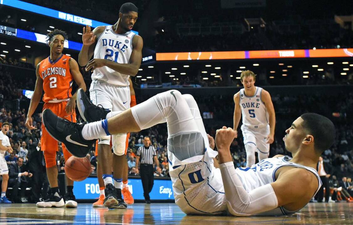 Jayson Tatum catches up with Duke University's Mike Krzyzewski