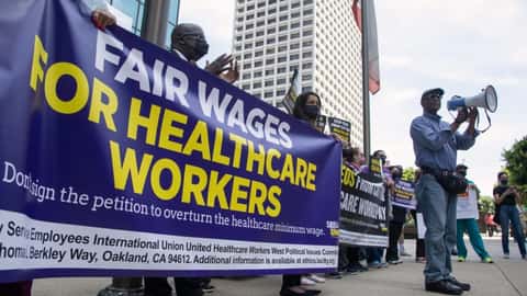 Stan Lyles, vice president of the SEIU-UHW union representing health care workers, speaks outside the offices of the Hospital Association of Southern California at a protest in favor of raising the...