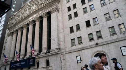 Wall Street swings sharply amid worries about rates, economy